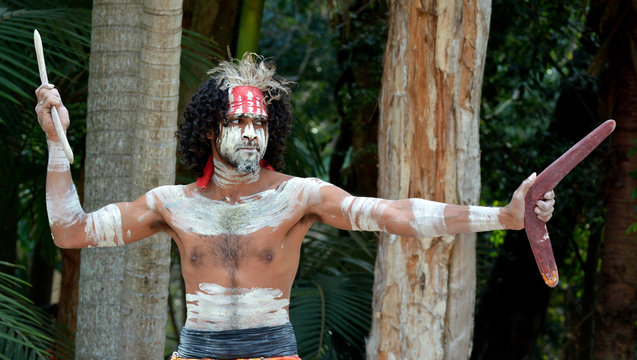 Yugambeh Aboriginal warrior throwing boomerang