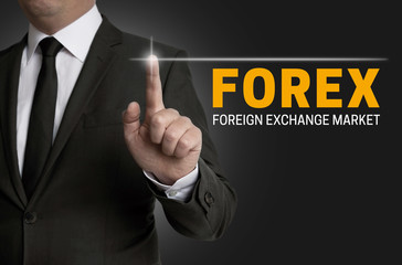 Forex touchscreen is operated by businessman