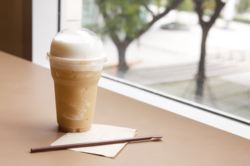 Cup of Coffee on Table.