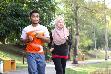 Obraz premium couple jogging in a park