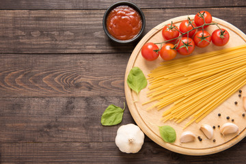 Italian food background, with tomato, garlic, pepper, spaghetti