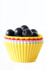 Blueberry in Colourful Cup in Vertical View on White Background.