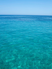 Fototapeta na wymiar Clear azure sea near Crete coast, Greece