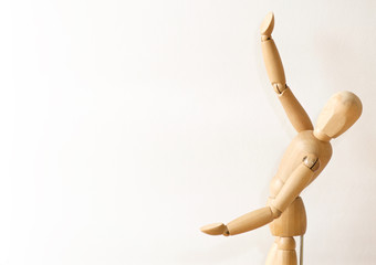 Wooden model gives presentation on white background