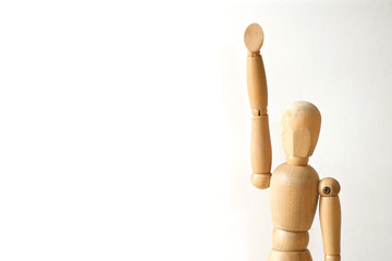 Wooden model raise his hand on white background