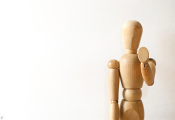 Wooden model in stop gesture on white background
