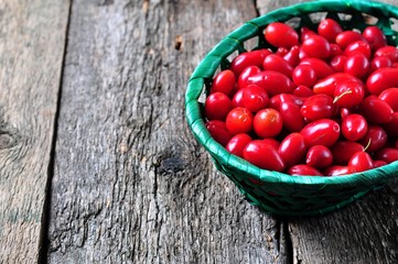 Organic dogwood in a green basket on a wooden table