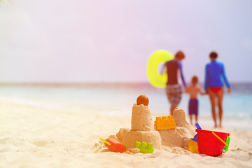 sand castle and toys on tropical beach