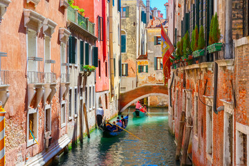 Fototapeta na wymiar Gondolas on lateral narrow Canal in Venice, Italy