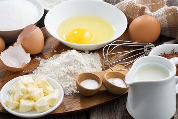 Baking ingredients on a wooden board, horizontal