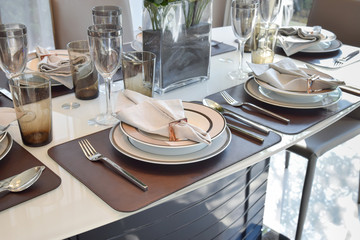 elegant table set in modern style dining room interior