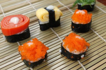 Closed up shushi food isolate on bamboo