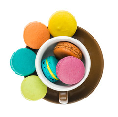 Colorful macarons on white background. Macaron or Macaroon is sw
