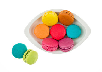 Colorful macarons on white background. Macaron or Macaroon is sw