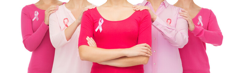 close up of women with cancer awareness ribbons