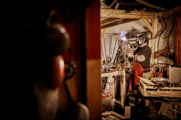 Obraz na płótnie Canvas Metal worker standing in workshop