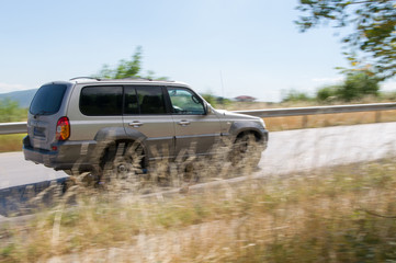 Fototapeta premium car driving at high speed in empty road