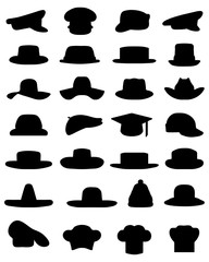 Black silhouettes of various caps and hats, vector