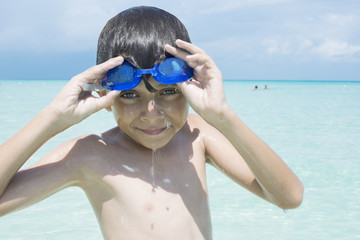 Child having fun in water while on vacation