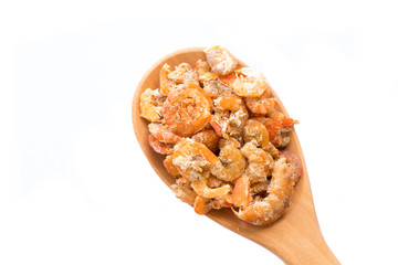 Dried shrimp put on wooden spoon isolated on white background.