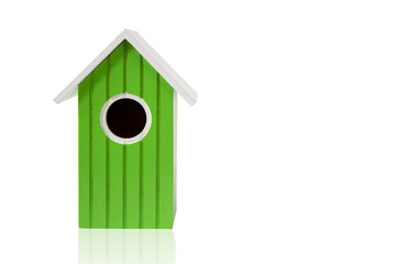 green nest box birdhouse house for birds isolated on white background with reflection