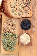 Brown bread with whole grain cereals of sliced and milk.