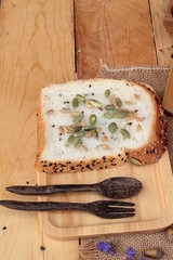 Brown bread with whole grain cereals of sliced and milk.