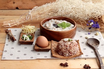 Fototapeta na wymiar Brown rice porridge put pork and brown rice with soft-boiled egg
