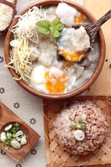 Brown rice porridge put pork and brown rice with soft-boiled egg