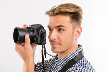 Fototapeta premium handsome young man photographing and smiling