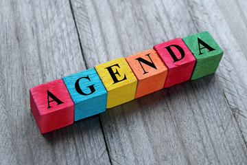 word agenda on colorful wooden cubes
