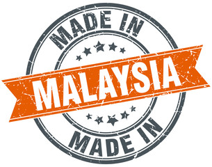 Malaysia orange grunge ribbon stamp on white