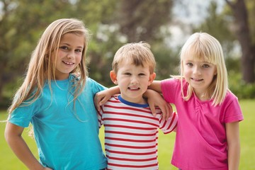 Fototapeta premium Smiling classmates with arms around each other