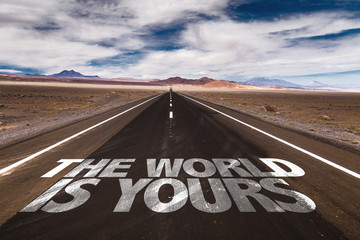 The World is Yours written on desert road