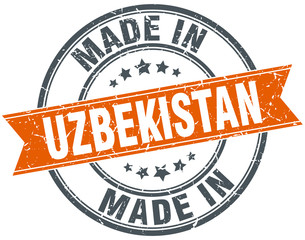 Uzbekistan orange grunge ribbon stamp on white