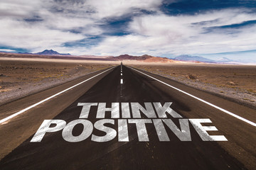 Think Positive written on desert road