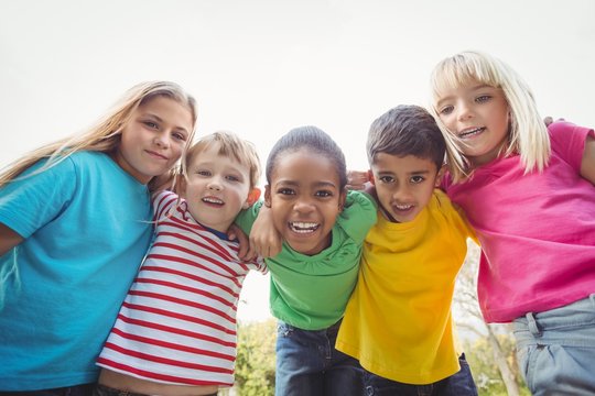 Smiling Classmates With Arms Around Each Other