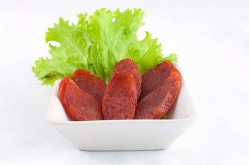 Appetizing Pork sausage on Lettuce