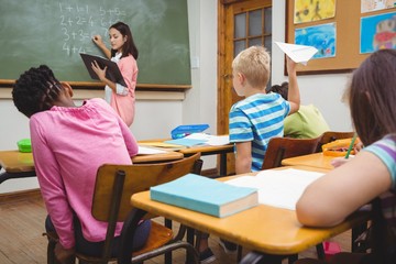 Student about to throw a paper airplane