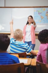 Student raising hand to ask a question