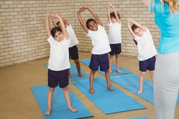 Happy students stretching out together