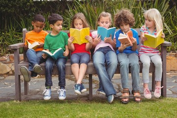 Children reading from books together