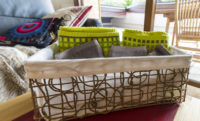 Fototapeta na wymiar Basket with towels on the table