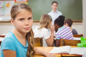 Fototapeta na wymiar Pupil frowning at camera during class