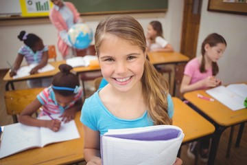 Pupil showing her work to camera