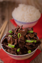 Concept of chinese food. Soy sauce cooked beef with star anise. Red cooked beef with rice and chopsticks