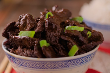 Concept of chinese food. Soy sauce cooked beef with star anise. Red cooked beef with rice and chopsticks