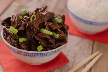 Concept of chinese food. Soy sauce cooked beef with star anise. Red cooked beef with rice and chopsticks