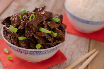 Concept of chinese food. Soy sauce cooked beef with star anise. Red cooked beef with rice and chopsticks