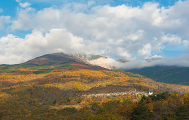 Autumnal landscape with view on Crimean mountains under a cloudy sky